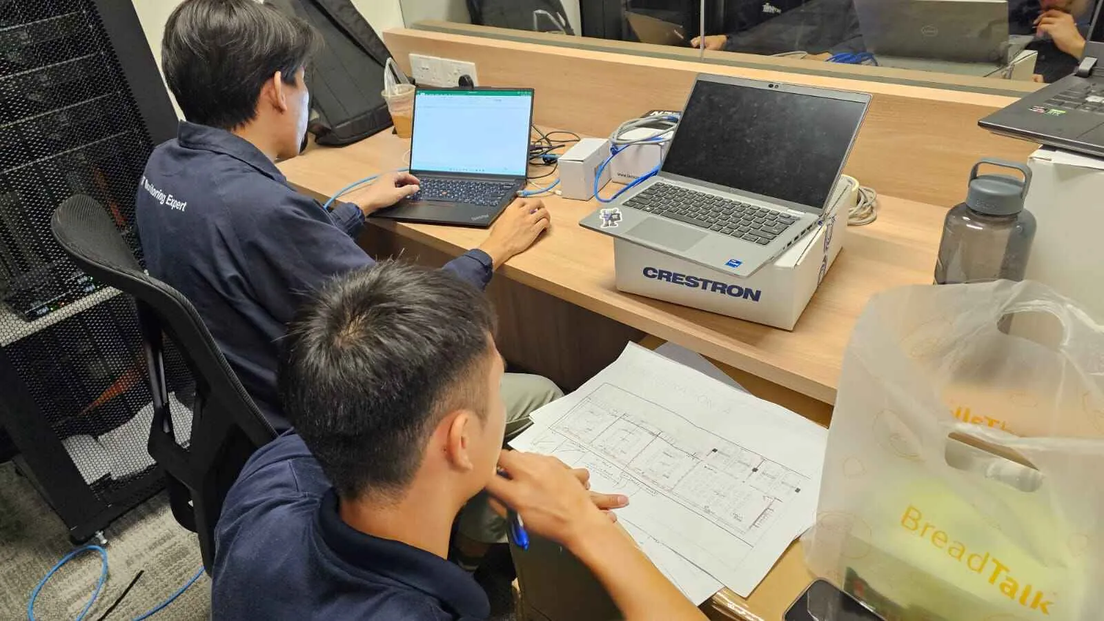 Digiworz engineers programming a control system